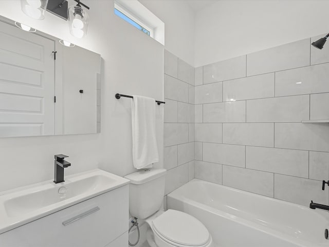 full bathroom with vanity, toilet, and tiled shower / bath