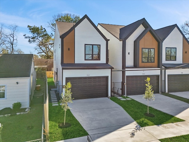 view of front of house with a front lawn and a garage