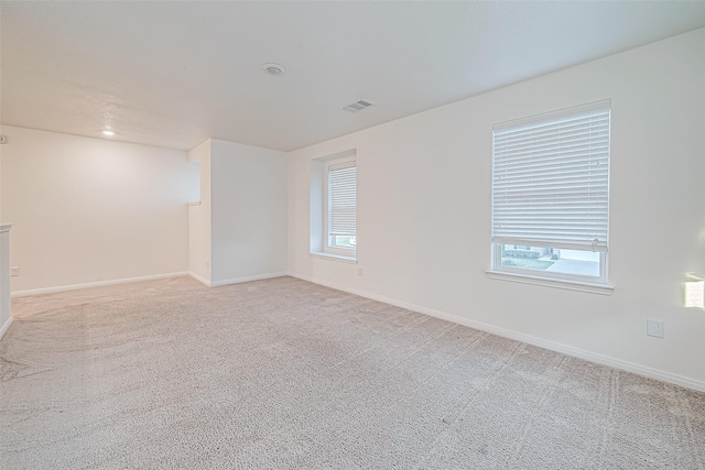 empty room with light colored carpet