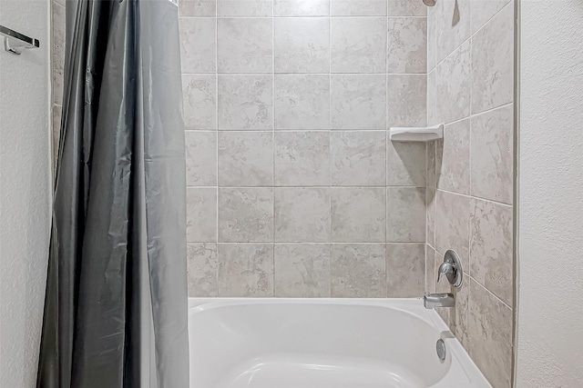 bathroom featuring shower / bath combo with shower curtain