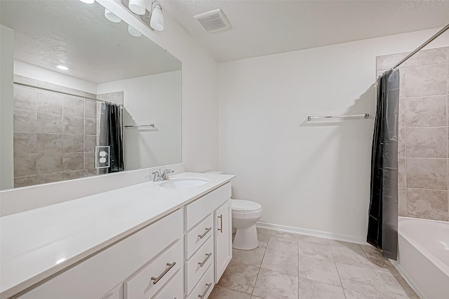 full bathroom featuring tile patterned floors, a textured ceiling, toilet, shower / tub combo with curtain, and vanity