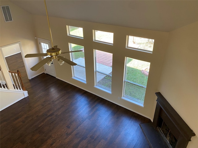 unfurnished living room with dark hardwood / wood-style floors