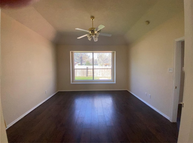 empty room featuring ceiling fan and dark hardwood / wood-style flooring