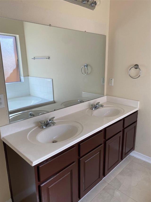 bathroom with a bath and vanity