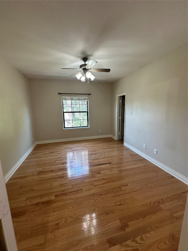 unfurnished room featuring light hardwood / wood-style flooring and ceiling fan