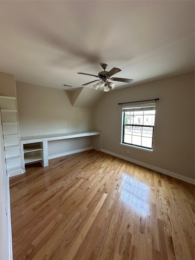 bonus room with light wood-type flooring, ceiling fan, and lofted ceiling