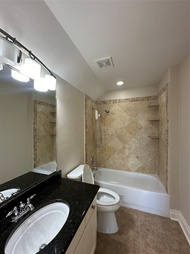 full bathroom with tile patterned floors, vanity, toilet, and tiled shower / bath