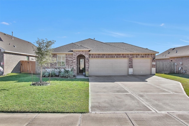 ranch-style house featuring a front yard and a garage