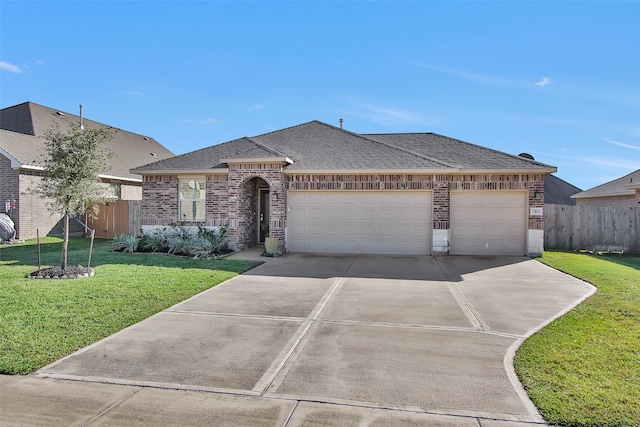 ranch-style home with a front yard and a garage