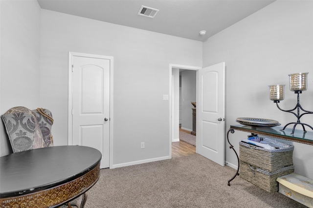 living area with light colored carpet