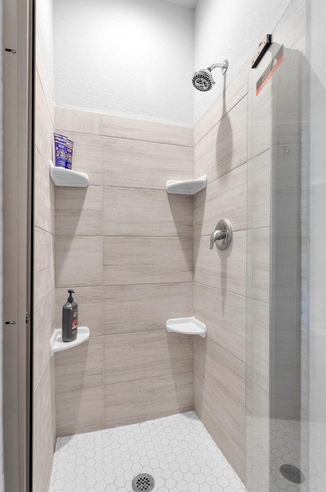 bathroom with a tile shower