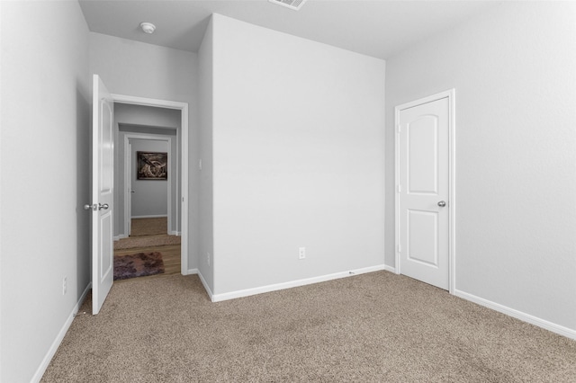 unfurnished room with carpet flooring