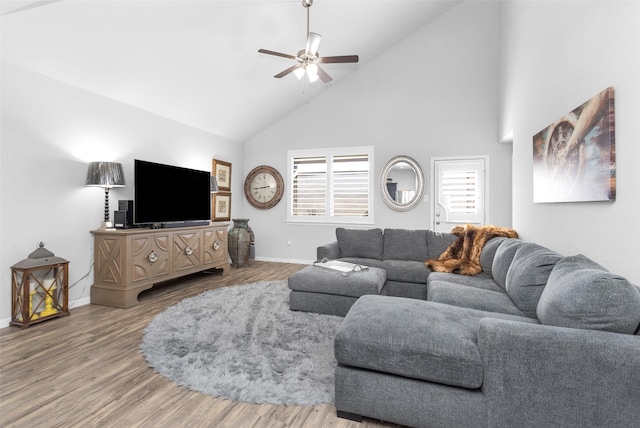 living room featuring ceiling fan, wood-type flooring, and high vaulted ceiling