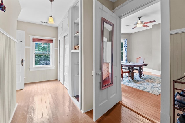 corridor featuring hardwood / wood-style floors