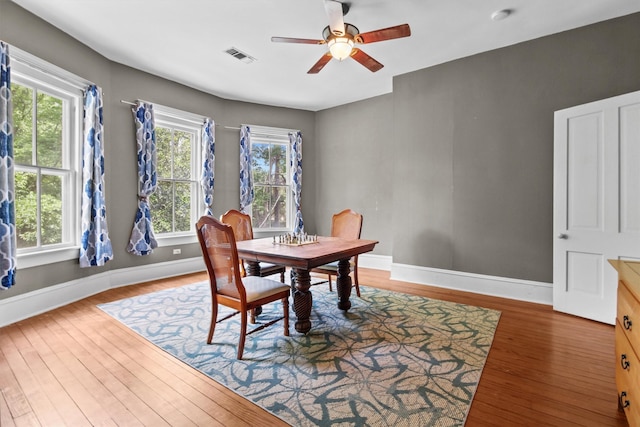 dining area featuring hardwood / wood-style floors and ceiling fan