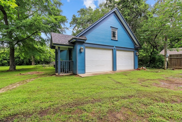 garage featuring a lawn