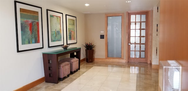 entryway featuring french doors and heating unit