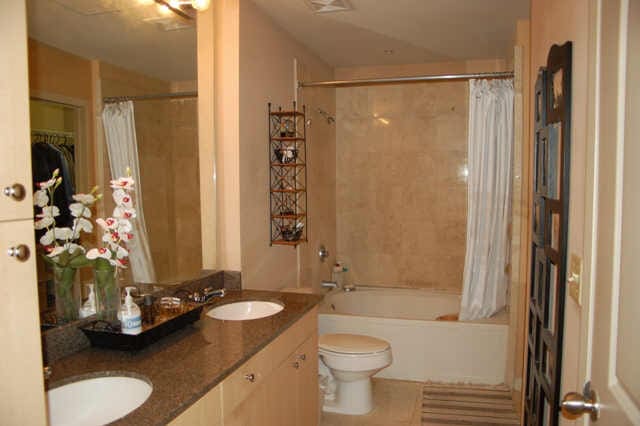 full bathroom with tile patterned floors, vanity, shower / bath combination with curtain, and toilet