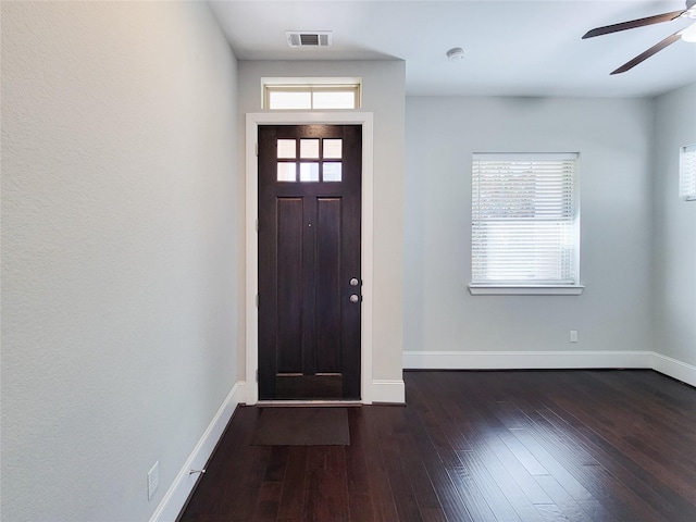 foyer entrance with dark hardwood / wood-style flooring and ceiling fan