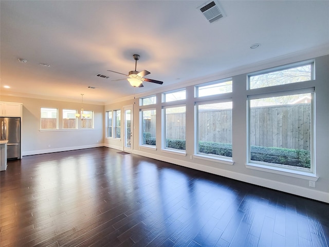 unfurnished room featuring dark hardwood / wood-style flooring, ceiling fan with notable chandelier, and ornamental molding