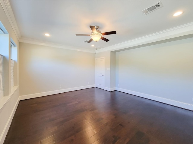 spare room featuring ceiling fan, dark wood-type flooring, and ornamental molding