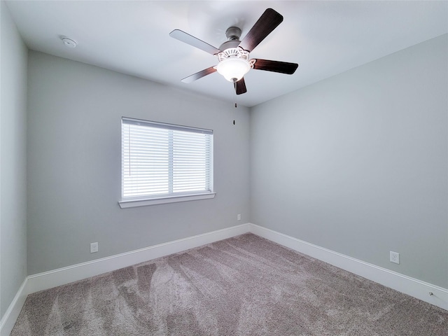 spare room with carpet flooring and ceiling fan