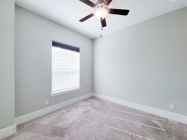 empty room featuring light carpet and ceiling fan