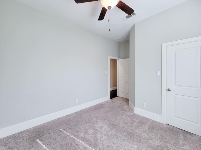 unfurnished bedroom featuring light carpet and ceiling fan