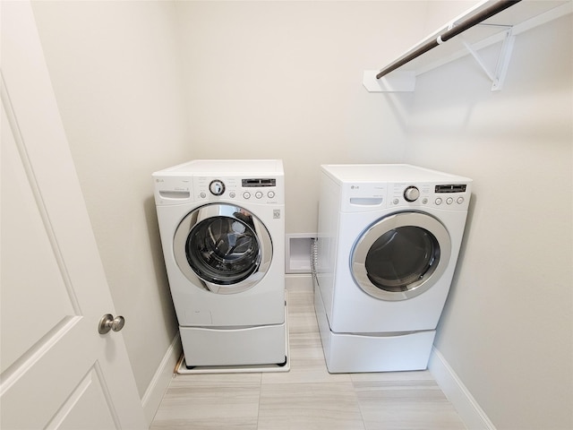 laundry area with washer and dryer