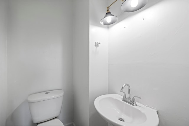 bathroom with toilet and sink