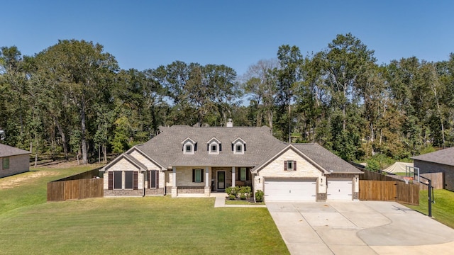 view of front of home with a front yard and a garage