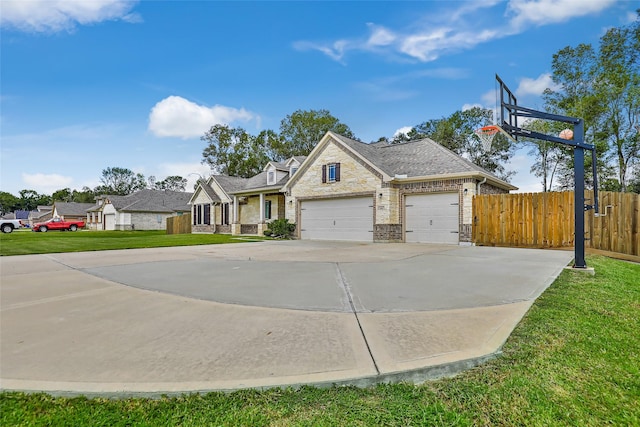 view of front facade featuring a garage and a front lawn