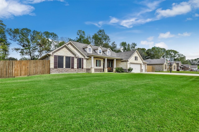 view of front of house with a front yard and a garage