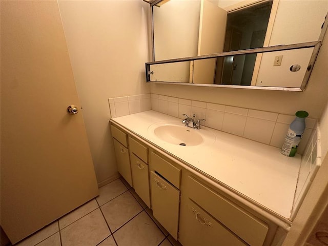 bathroom featuring tile patterned flooring and vanity