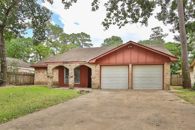 view of front of property with a front lawn and a garage