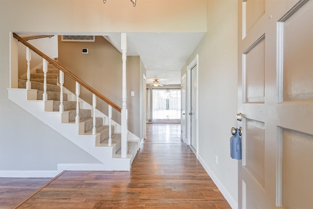 entryway featuring ceiling fan and hardwood / wood-style flooring