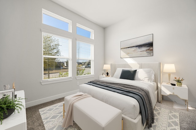 bedroom with carpet flooring and multiple windows