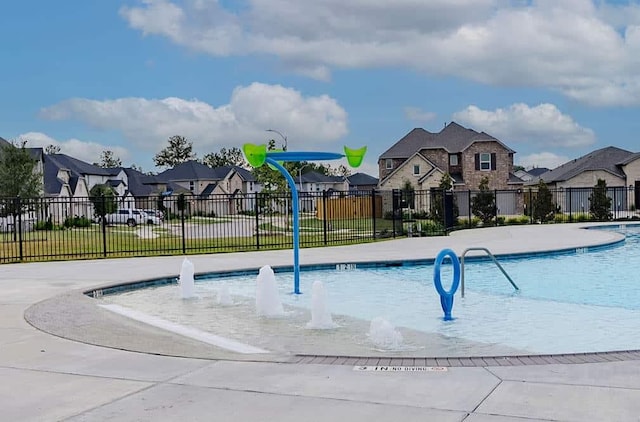 view of pool with pool water feature