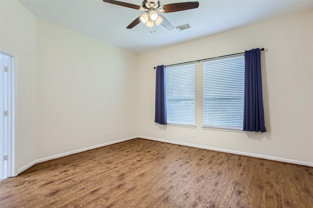 empty room featuring ceiling fan and wood-type flooring