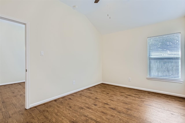 unfurnished room featuring ceiling fan, wood-type flooring, and vaulted ceiling