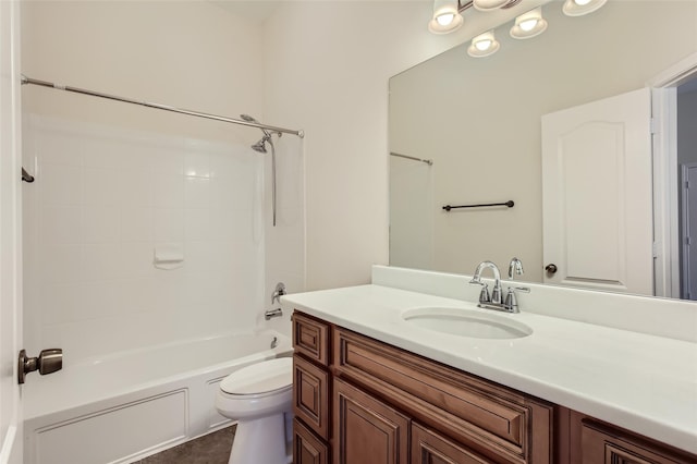 full bathroom featuring vanity, bathtub / shower combination, and toilet