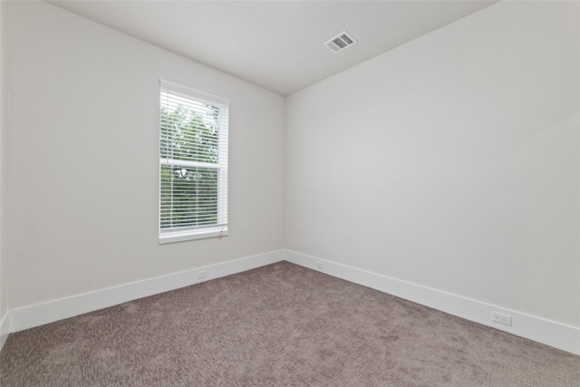 unfurnished room with carpet floors