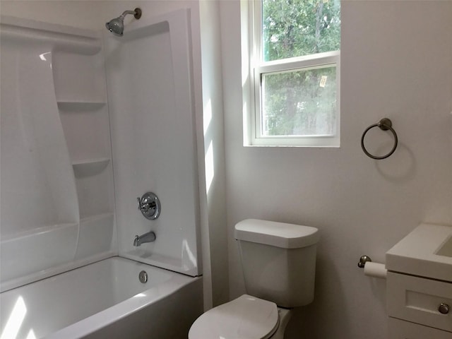 full bathroom featuring vanity, shower / washtub combination, toilet, and a wealth of natural light