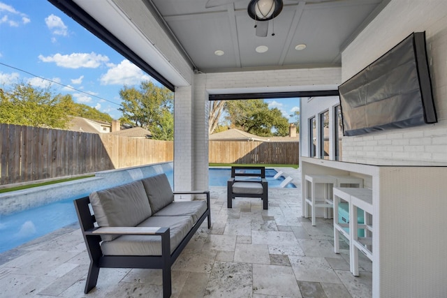 view of patio / terrace featuring a fenced in pool and an outdoor hangout area