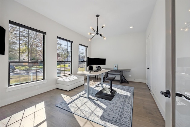 office with a wealth of natural light, french doors, a chandelier, and hardwood / wood-style flooring