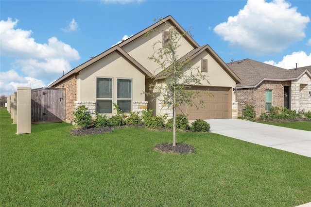 view of front facade with a garage and a front lawn