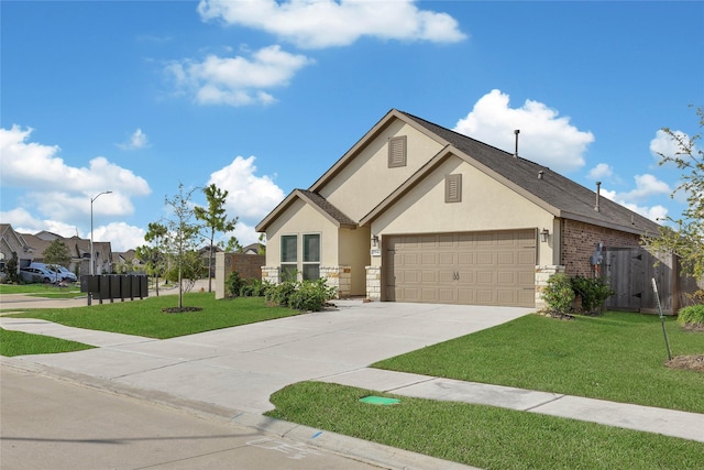 view of front facade with a front yard and a garage