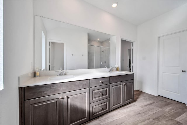 bathroom with vanity and walk in shower