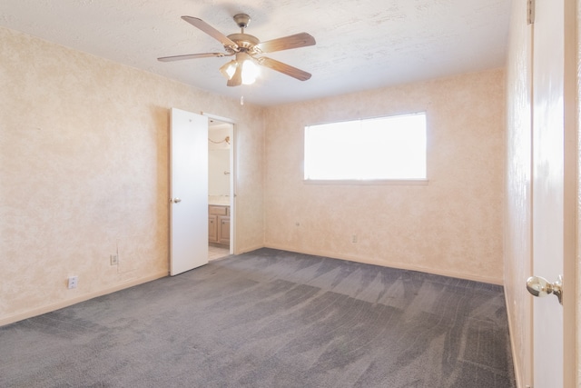 unfurnished room with ceiling fan and carpet