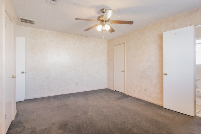 unfurnished room with carpet flooring and ceiling fan